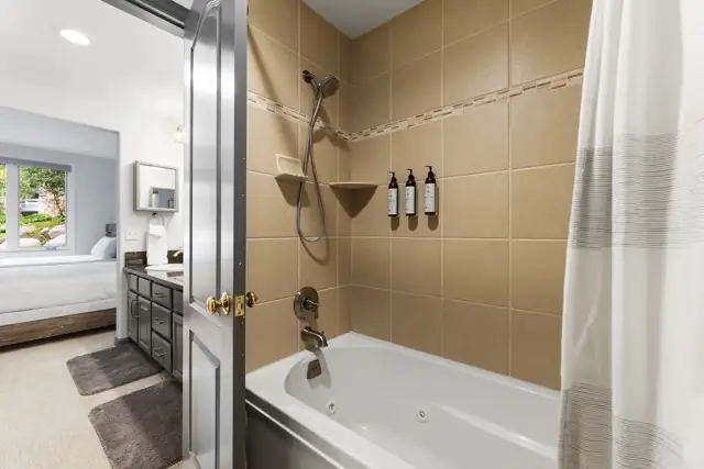 Full bathroom with tub and shower